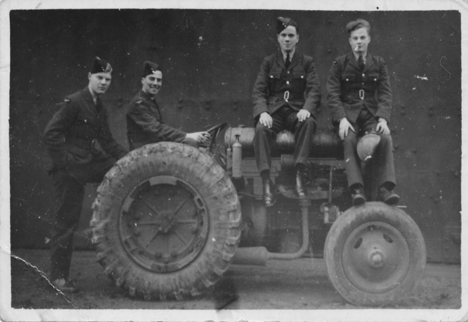 4 Men sitting on Tractor