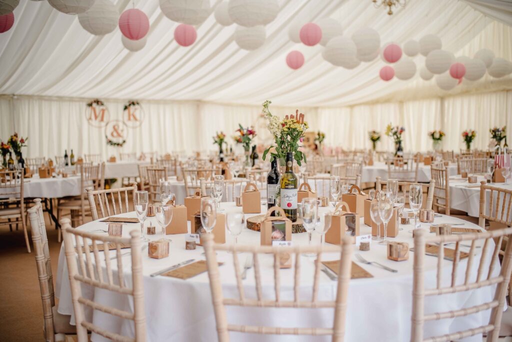 A marquee set up for a wedding with a natural theme