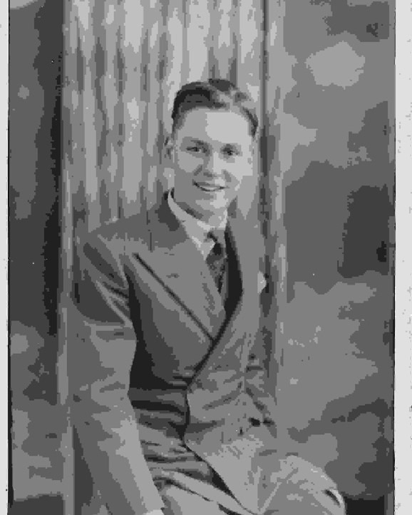 Alec Cousins - black and white photo of a young man wearing WW2 RAF uniform