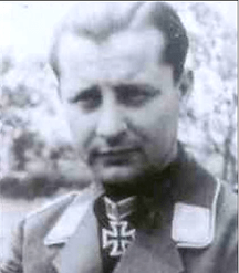 Black and white photo of the head and shoulders of a man in German uniform