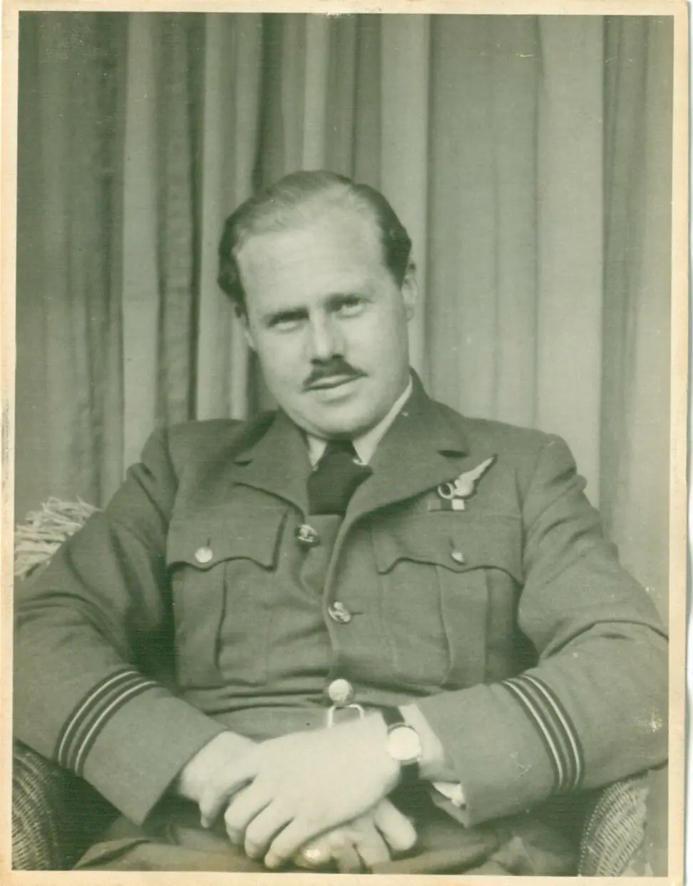 My Father's Story - A black and white photo of a man in RAF WW2 uniform sitting in a chair