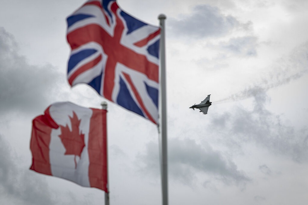 Colour picture of the Canadian and UK flags with an RAF Typhoon