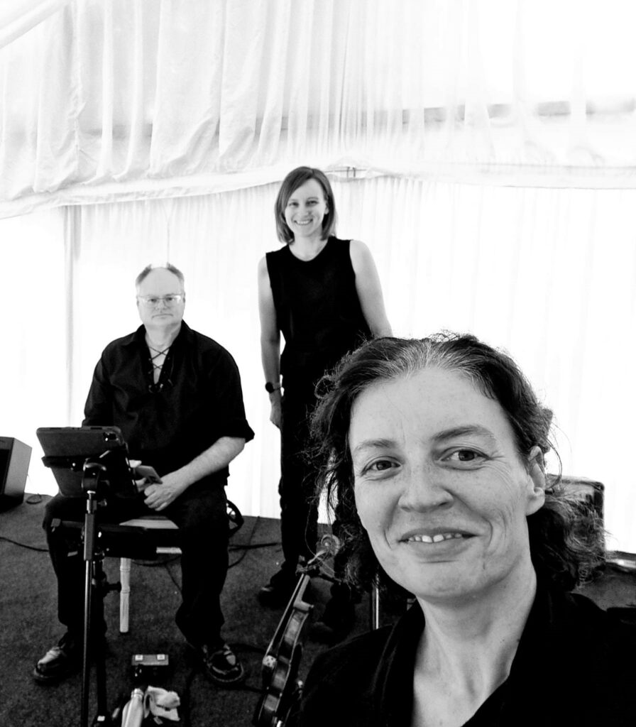 IBCC Ceilidh - Black and white picture of 3 people