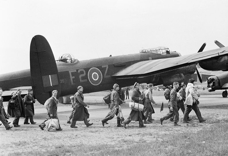 Operation Exodus -Black and White photograph of a Lancasters and men in uniform