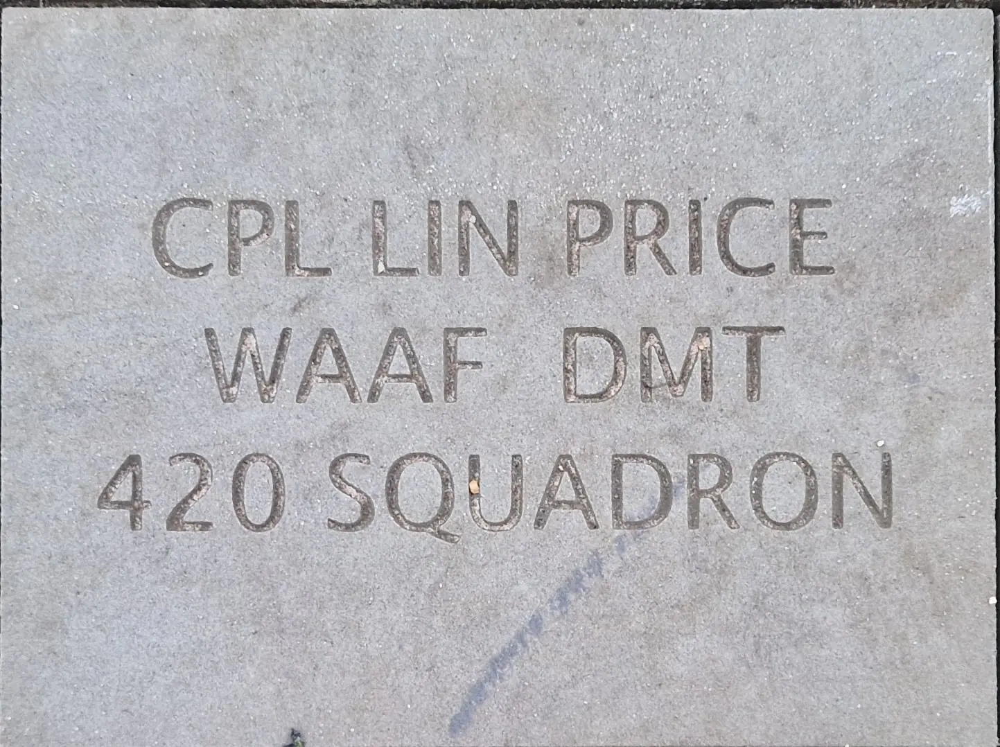 Corporal Lin Price - colour picture of a carved stone