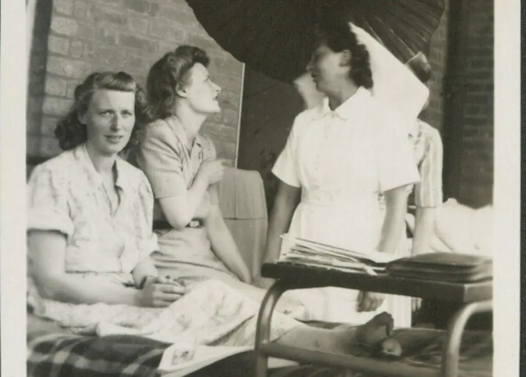 Women in war - black and white picture of a military nurse and two others