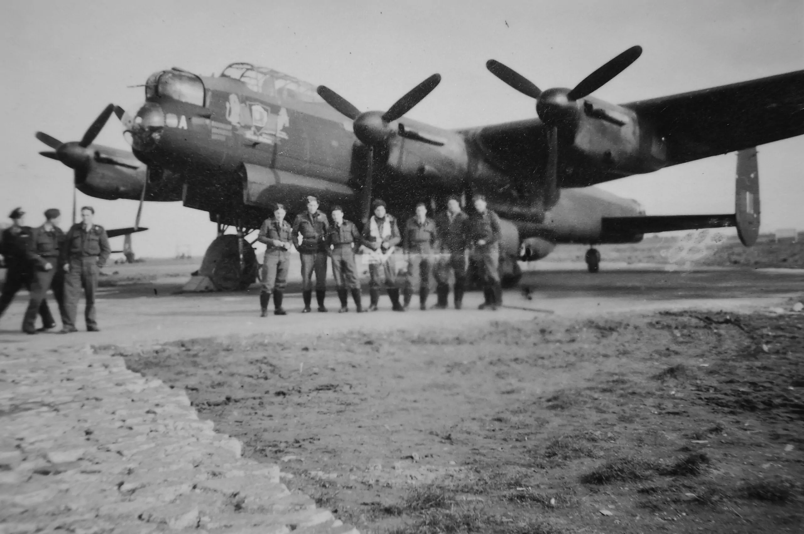 Black and white image - Lancaster and crew